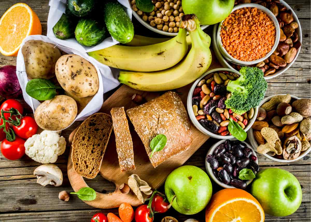 A range of healthy foods scattered across the table